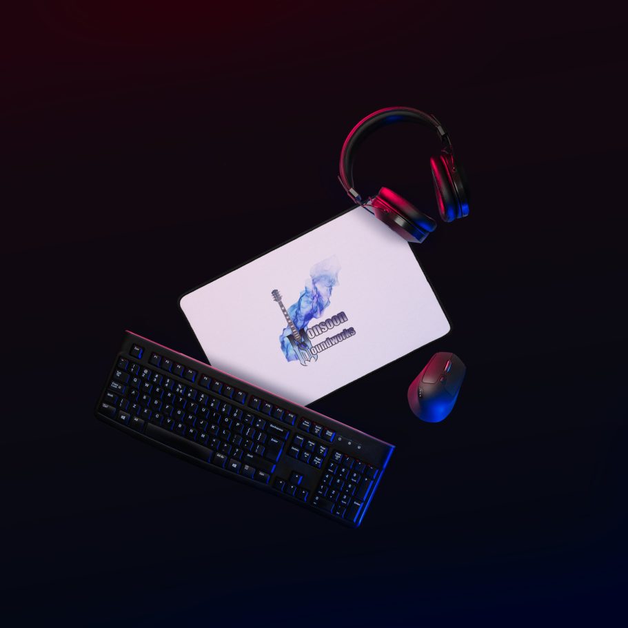 A gaming keyboard, mouse, and headset on a dark background.